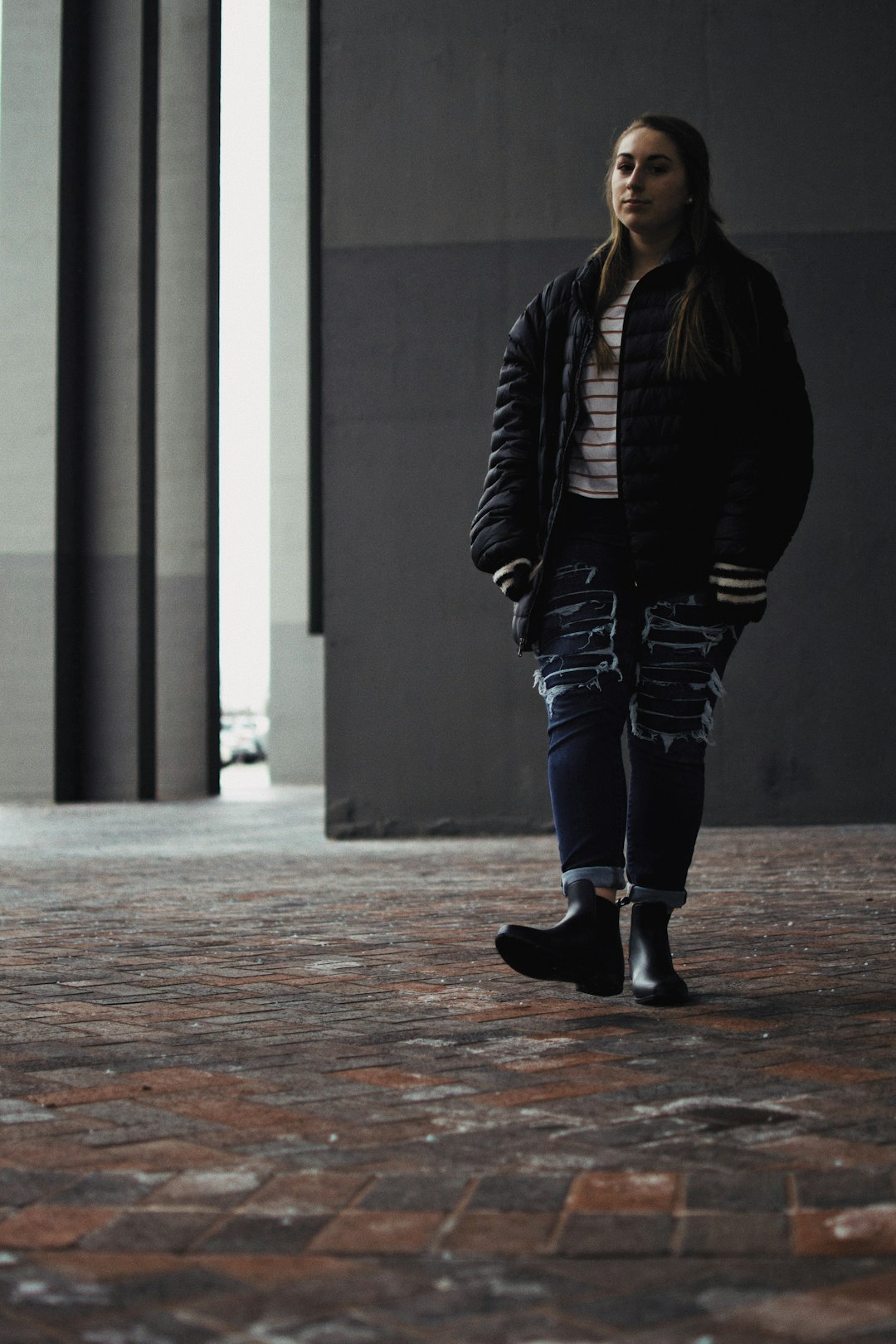 woman standing wearing black jacket