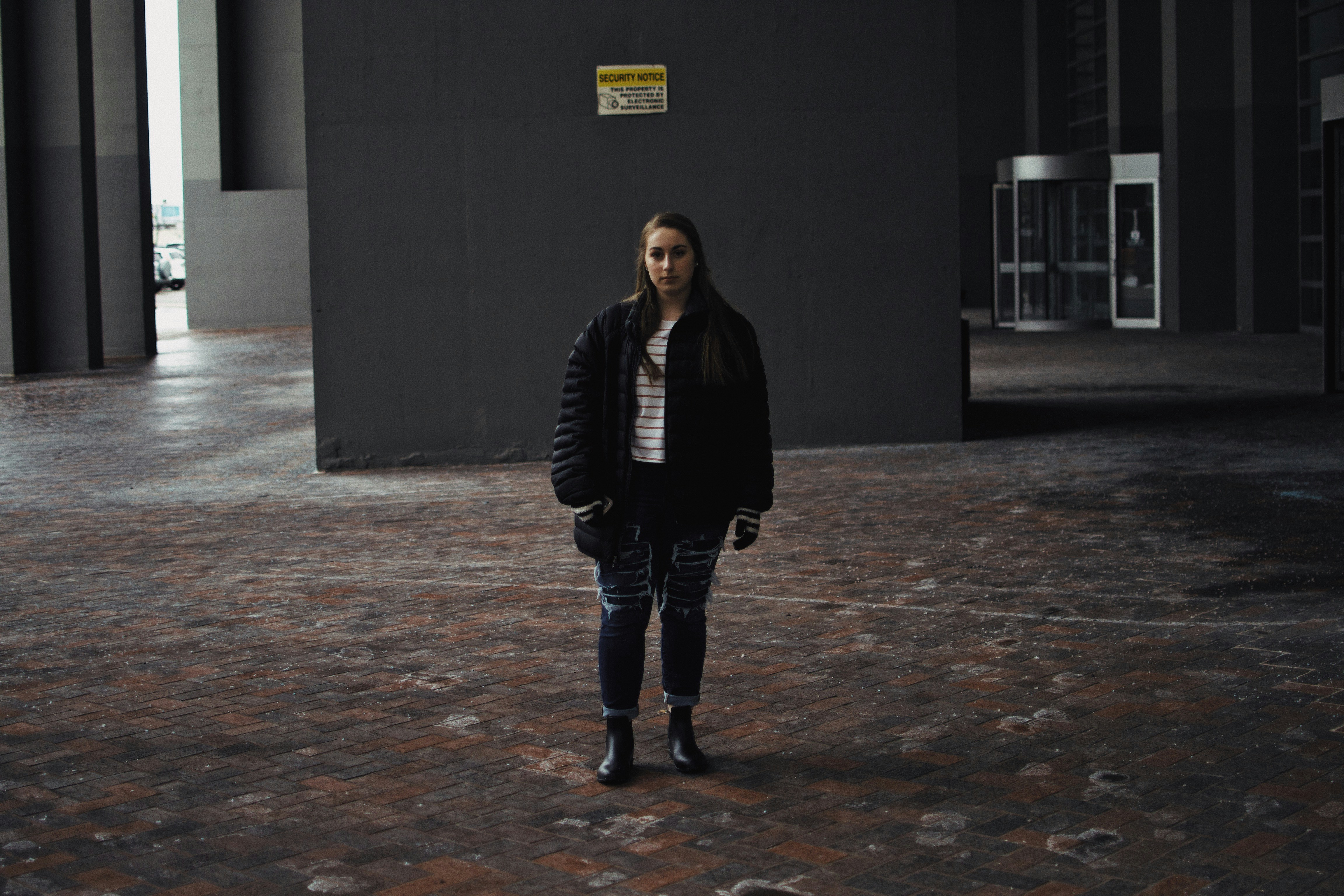 woman standing near wall