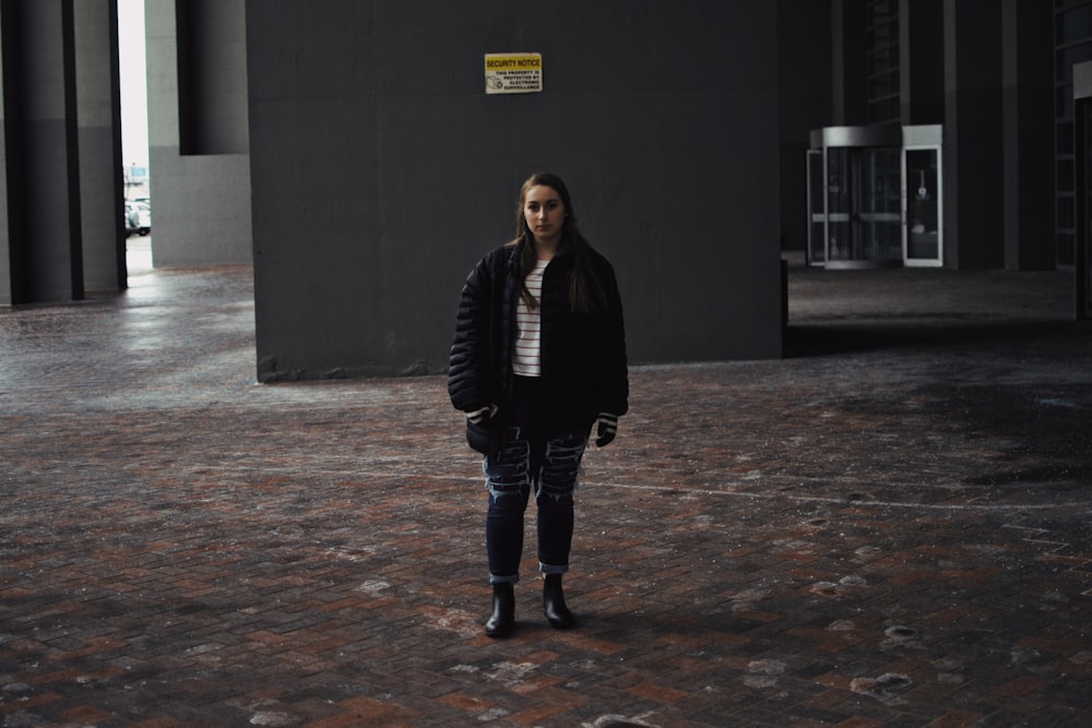 woman standing near wall