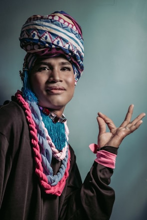 person wearing black and multicolored top