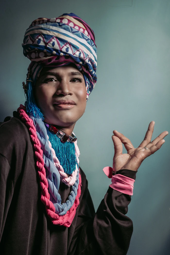Drag performer in a bold multicolored sequin look