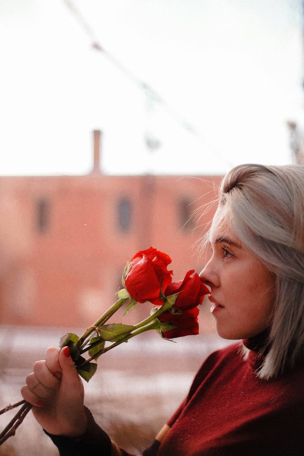 woman smelling rose