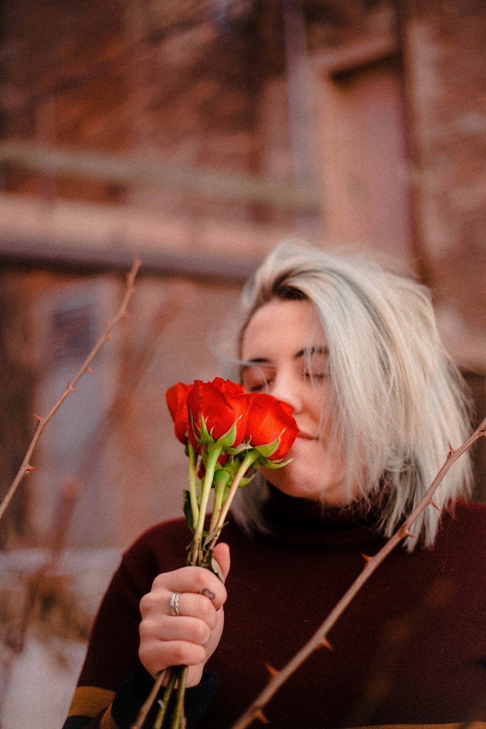 woman smelling rose