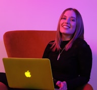 sitting woman while using MacBook