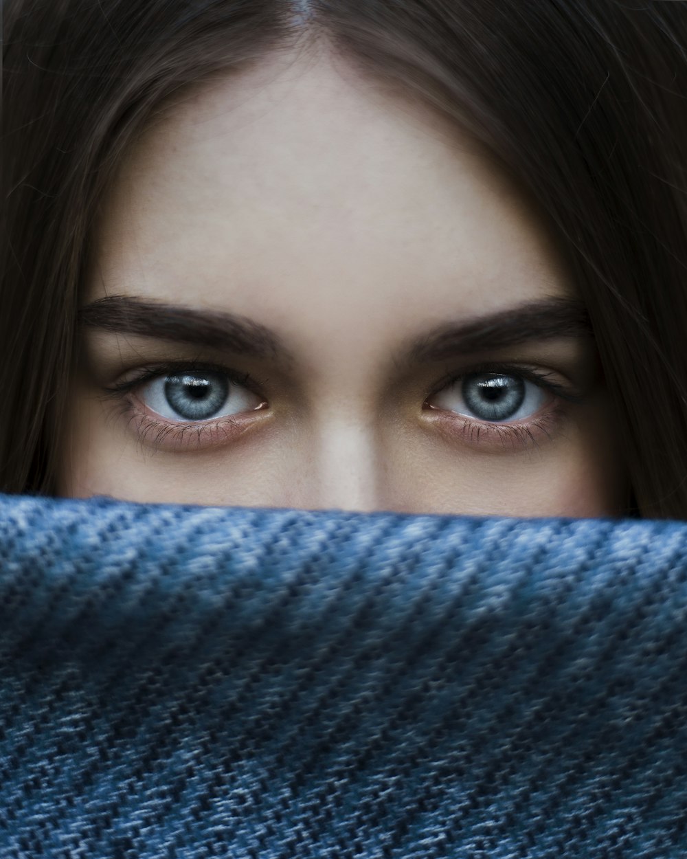 a close up of a person with blue eyes