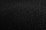 a black and white photo of a black surface