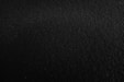 a black and white photo of a black surface