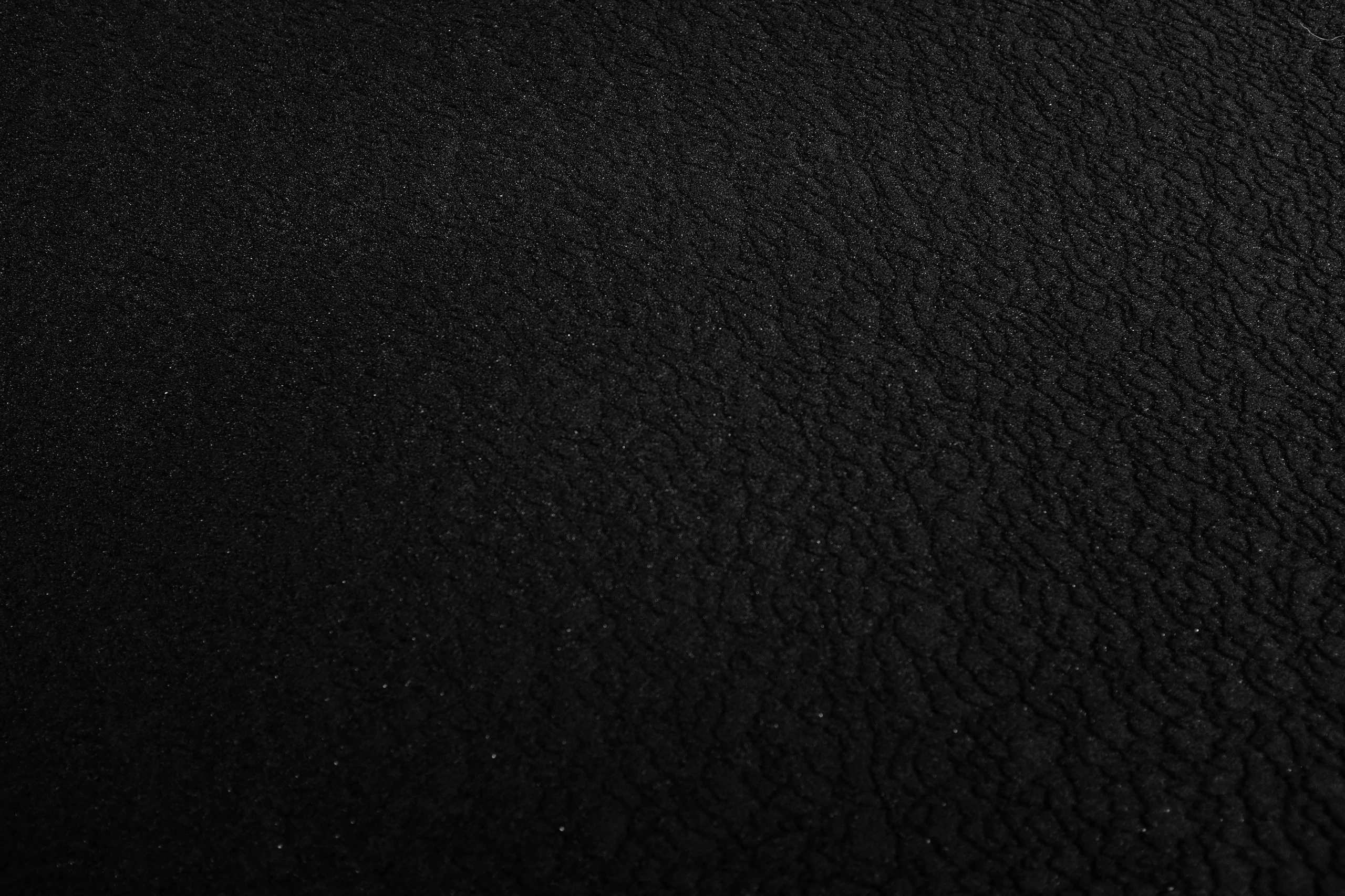 Close-up of a black pebble-grain texture