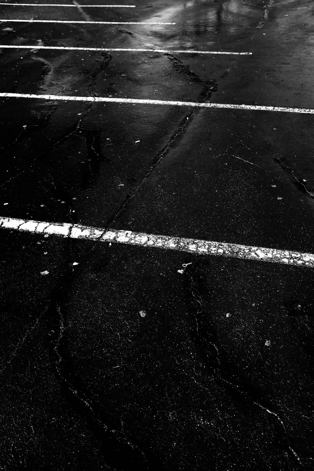 a black and white photo of a parking lot