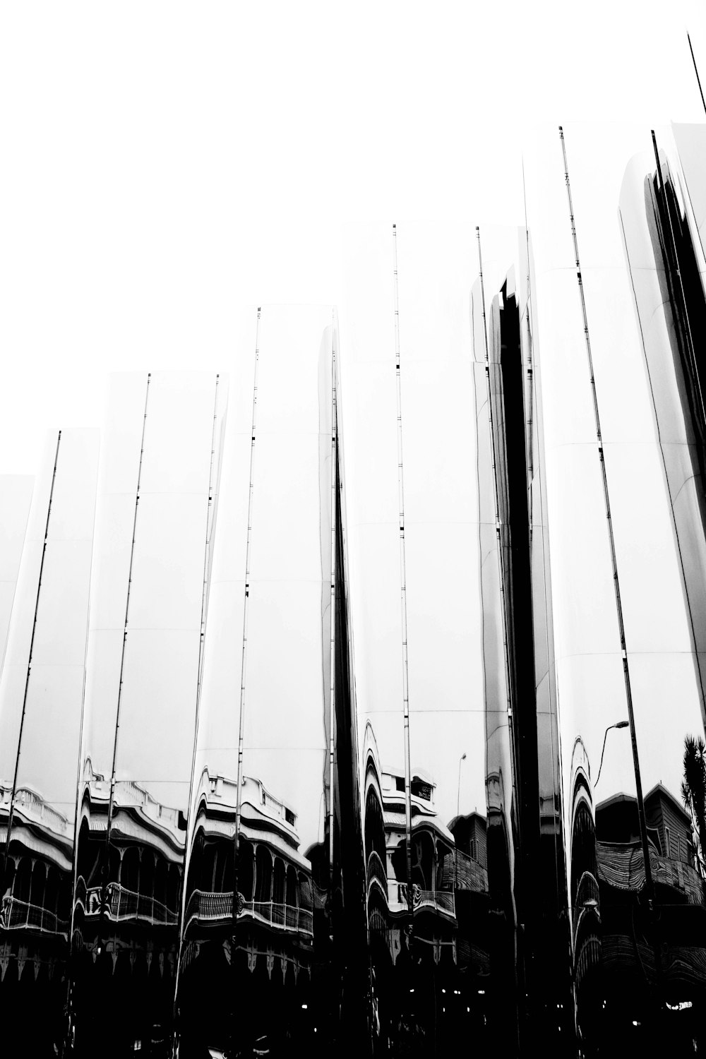 a black and white photo of a group of mirrors