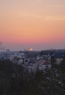 Sunset view over Bangkok skyline with soft pastel colors.