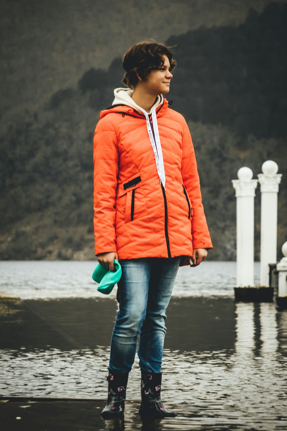 woman in orange bubble jacket