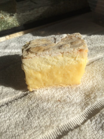 Close-up of creamy cheese blocks with natural textures.