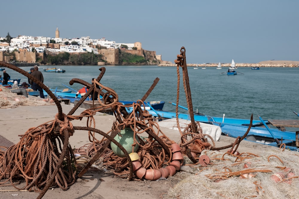 brown metal with rope near ocean