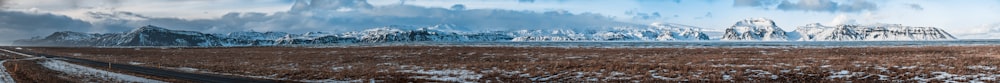 vast field with mountain ranges