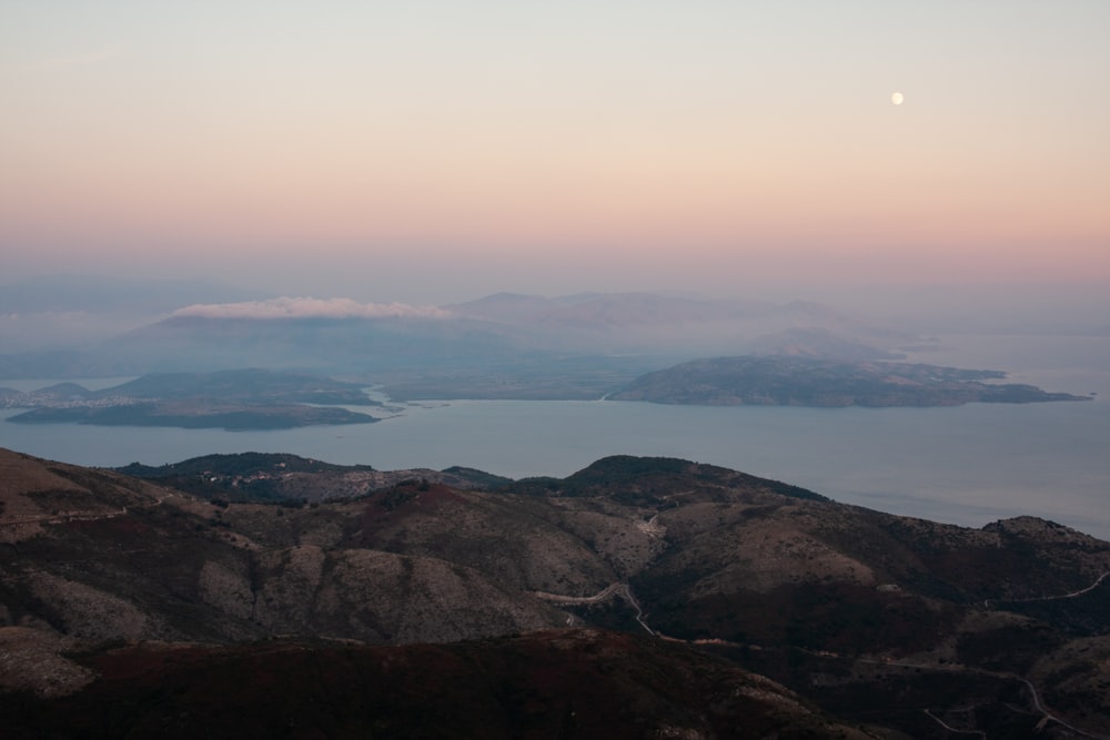 mountains and body of water during daytime