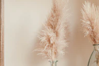 A studio space featuring subtle pampas and greenery designs that blend seamlessly with minimalist furnishings.