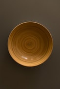 Close-up of a handcrafted wooden bowl made from rich, reprocessed hardwood.