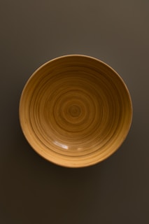A beautifully crafted wooden bowl with a smooth finish.