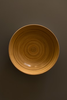 Decorative wooden bowl with smooth finish and organic shape.