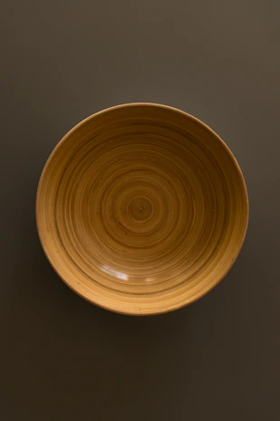 Close-up of a handcrafted wooden serving tray with natural grain and smooth finish.