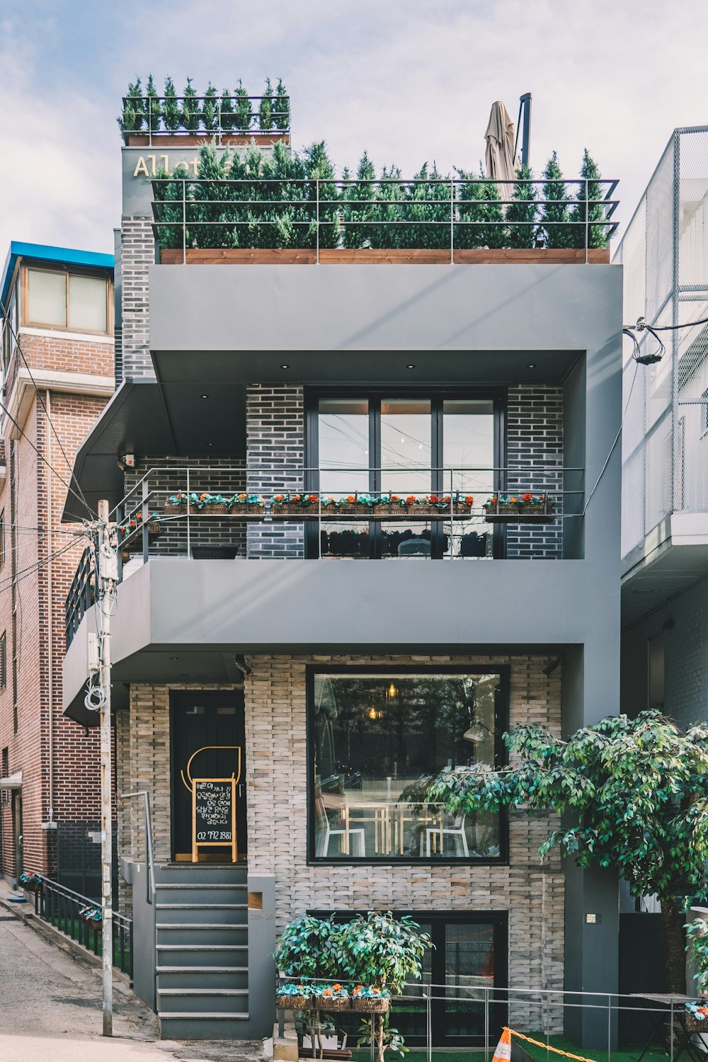 gray and brown 2-storey house