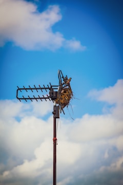 black metal post under blue sky