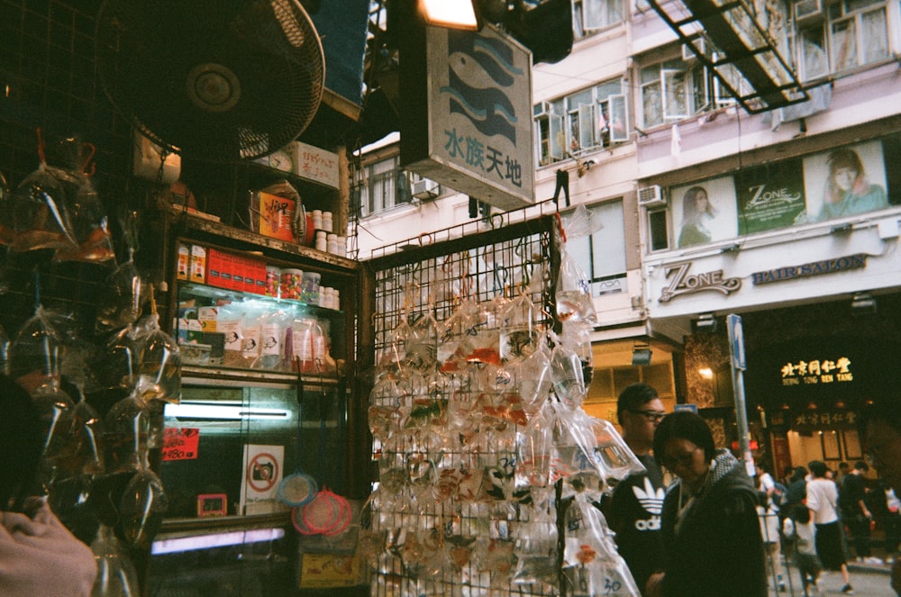 two man and woman standing beside store