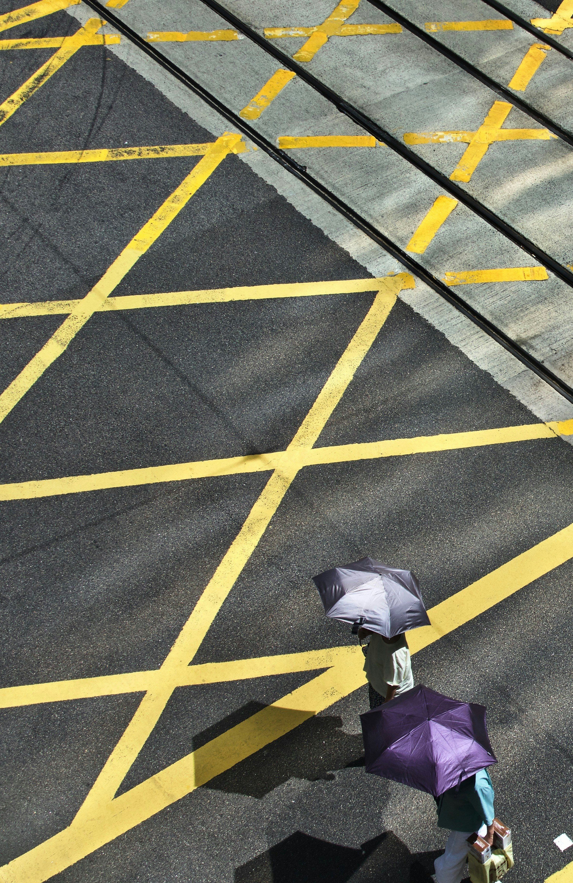 people walking and using umbrella