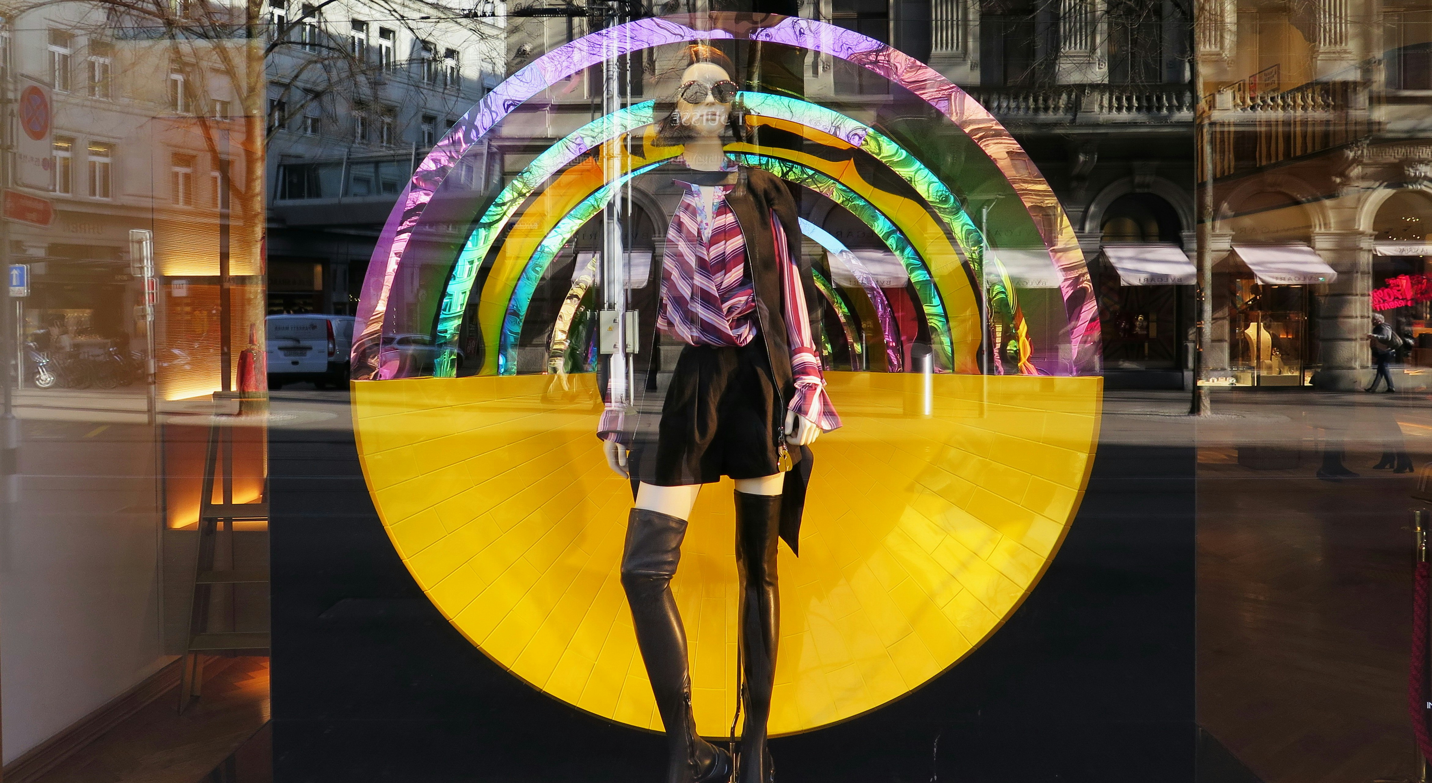 mannequin wearing red and white long-sleeved top and brown shorts