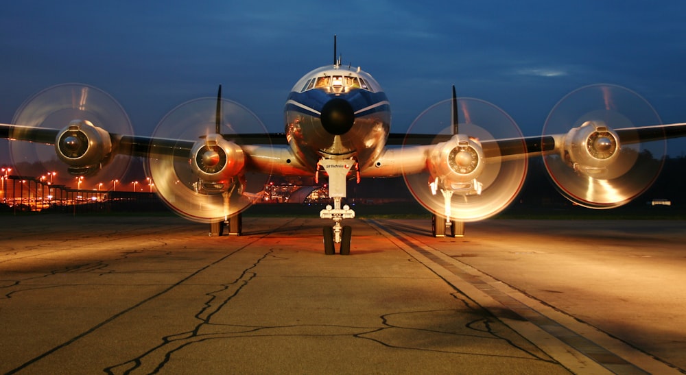 gray airplane about to fly on runway