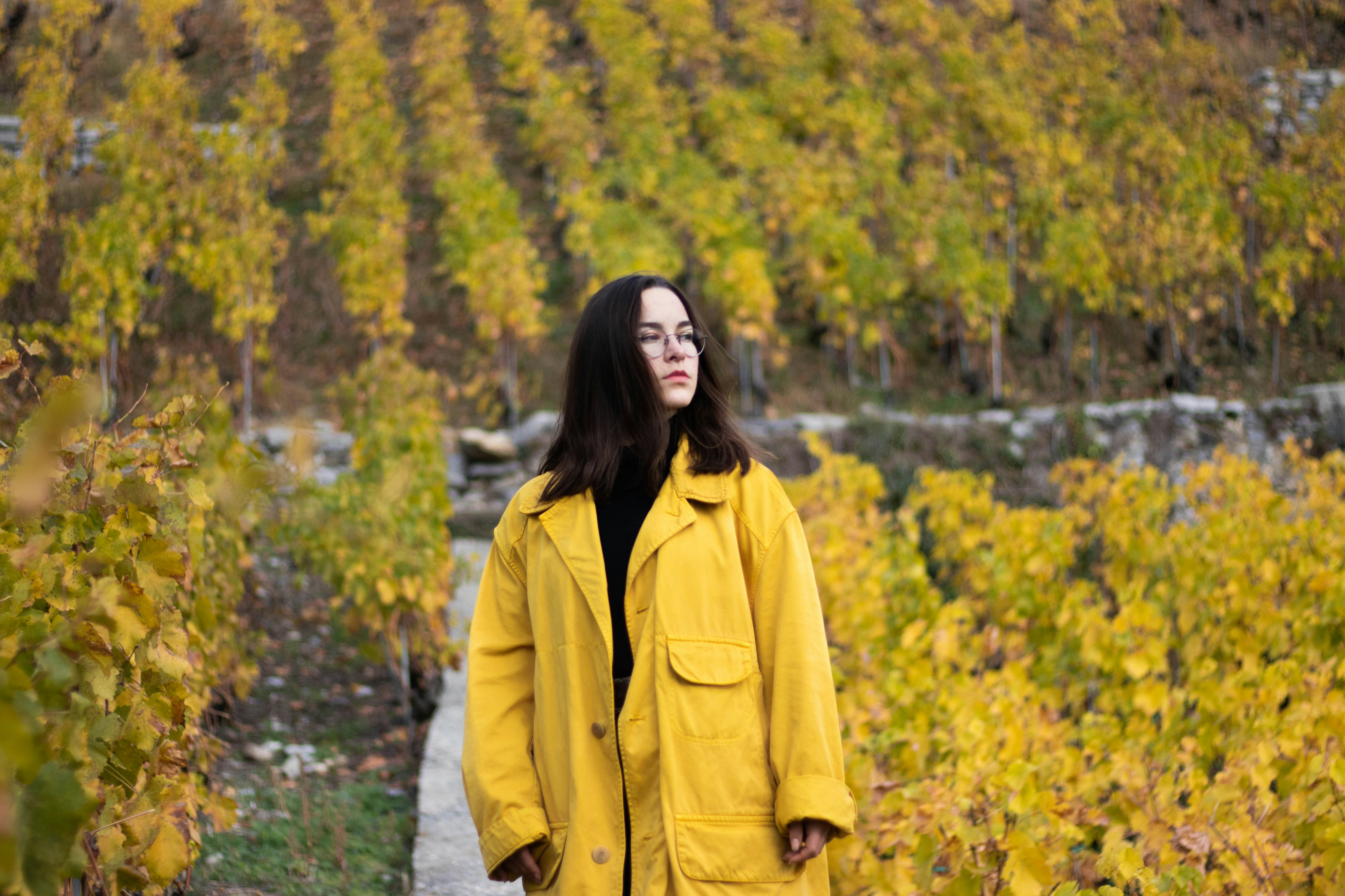 woman standing on yellow flower field