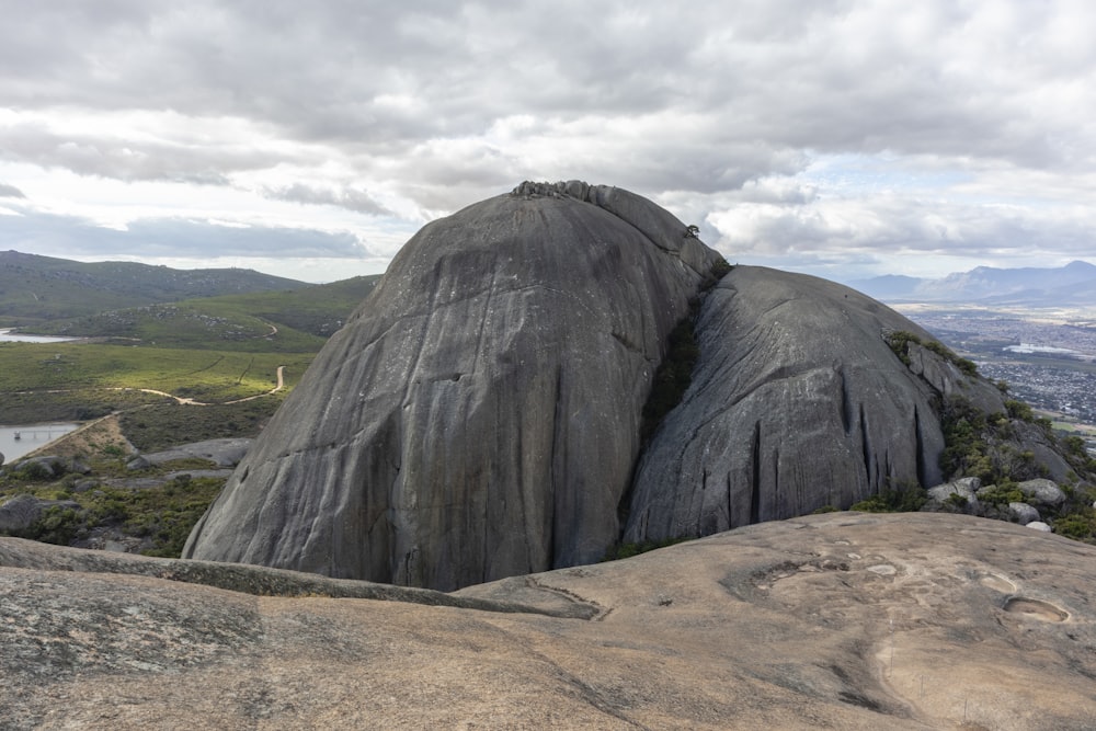 a view of a large rock out in the distance