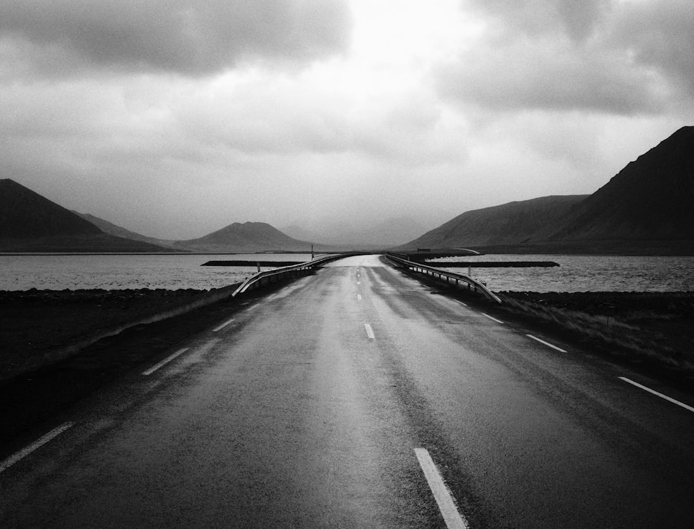 grayscale photography of empty road