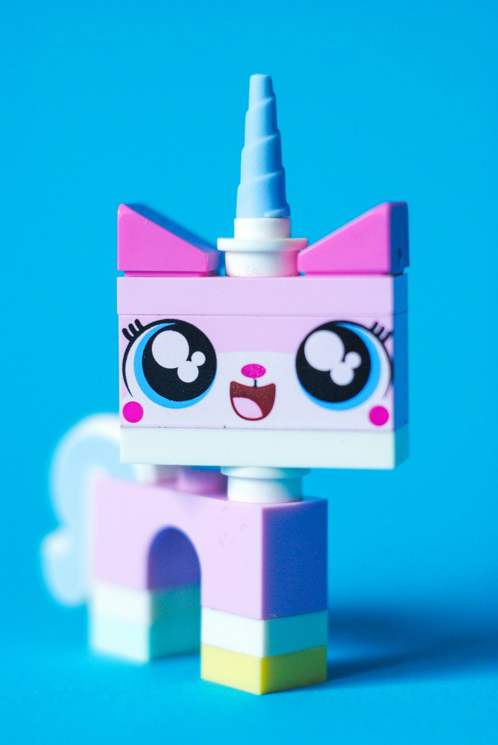 pink and white unicorn lego toy