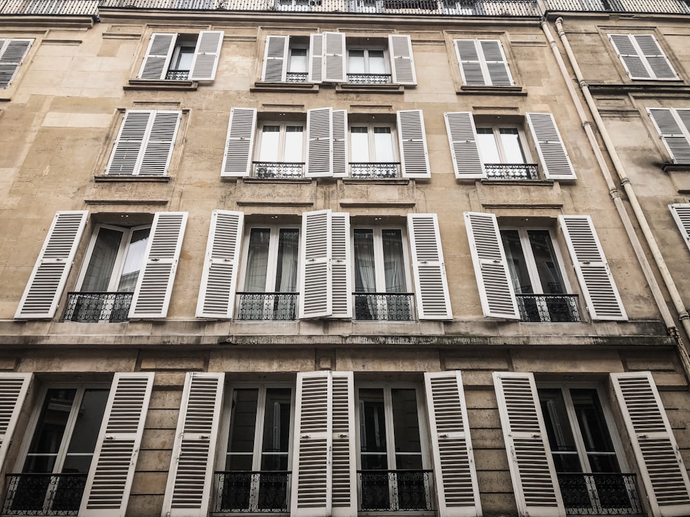 brown concrete buildings in low-angle view photography