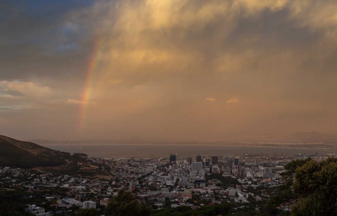 rainbow above urban area