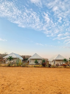 three white beach houses