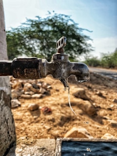 A close-up of durable water taps installed in a rural community water project.
