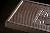 An engraved chocolate bar featuring a personalized photo and message, ready for gifting.