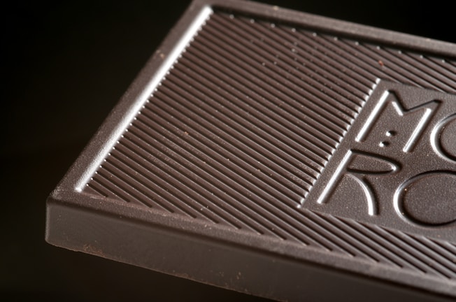 Close-up of rich, handmade chocolate bars with rustic textures