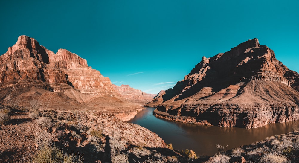 brown cliffs near body of water