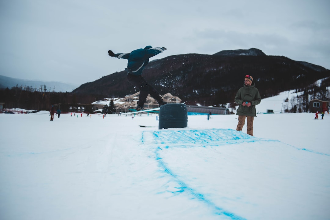 man standing on snow field