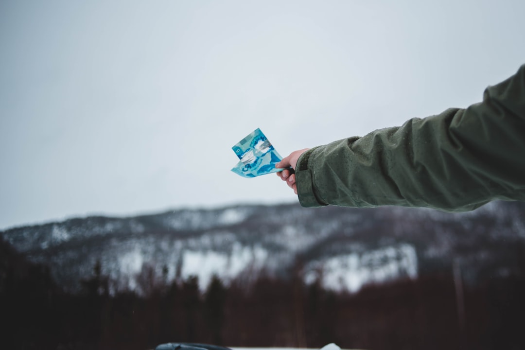 person holding blue sachet