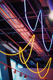 Bright LED lights casting vibrant colors in a modern industrial setting.