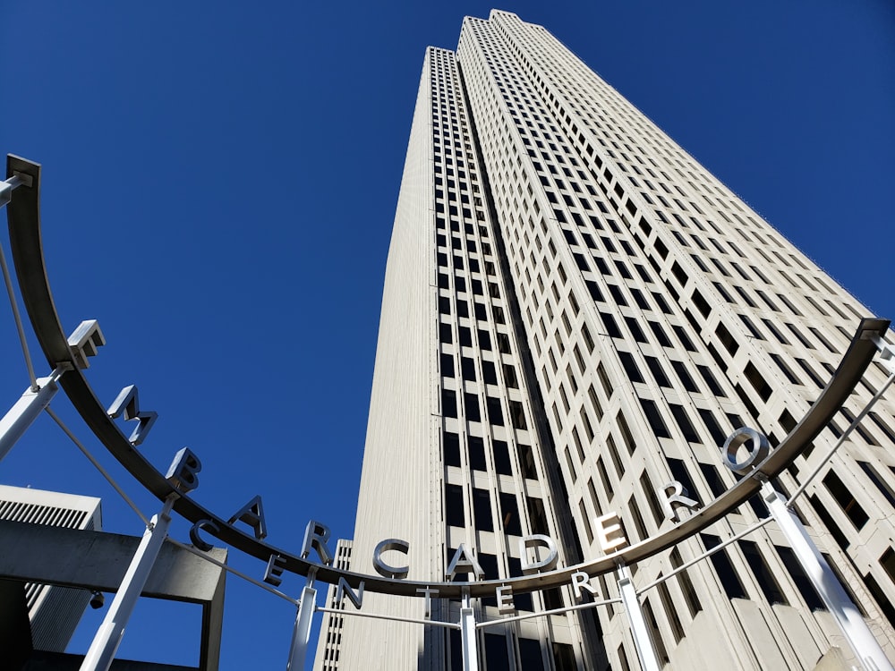 Embarcadero sign across white tall building