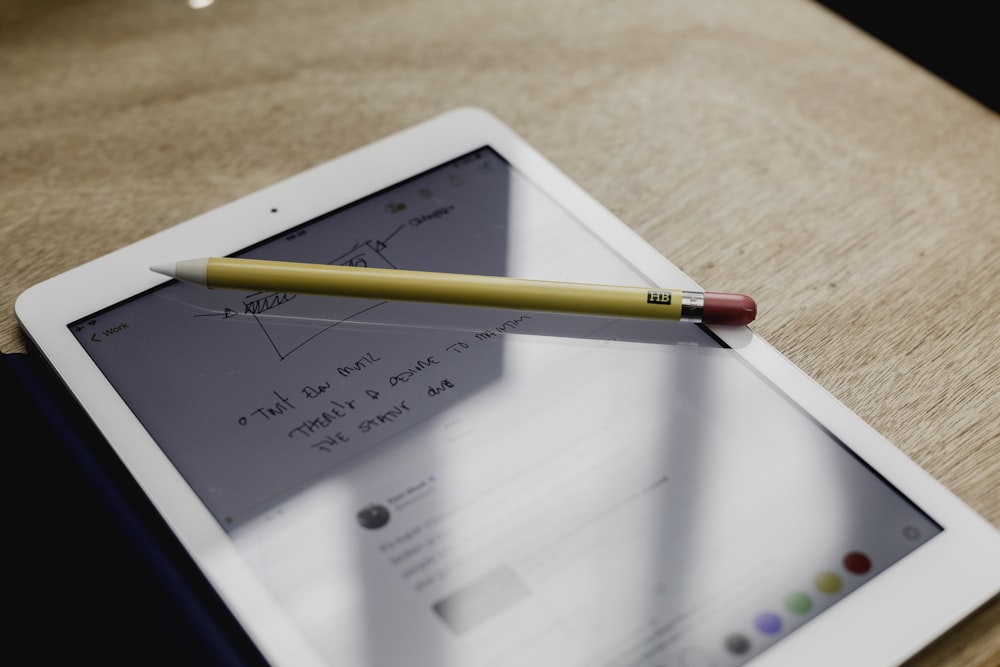smart pen on turned-on tablet