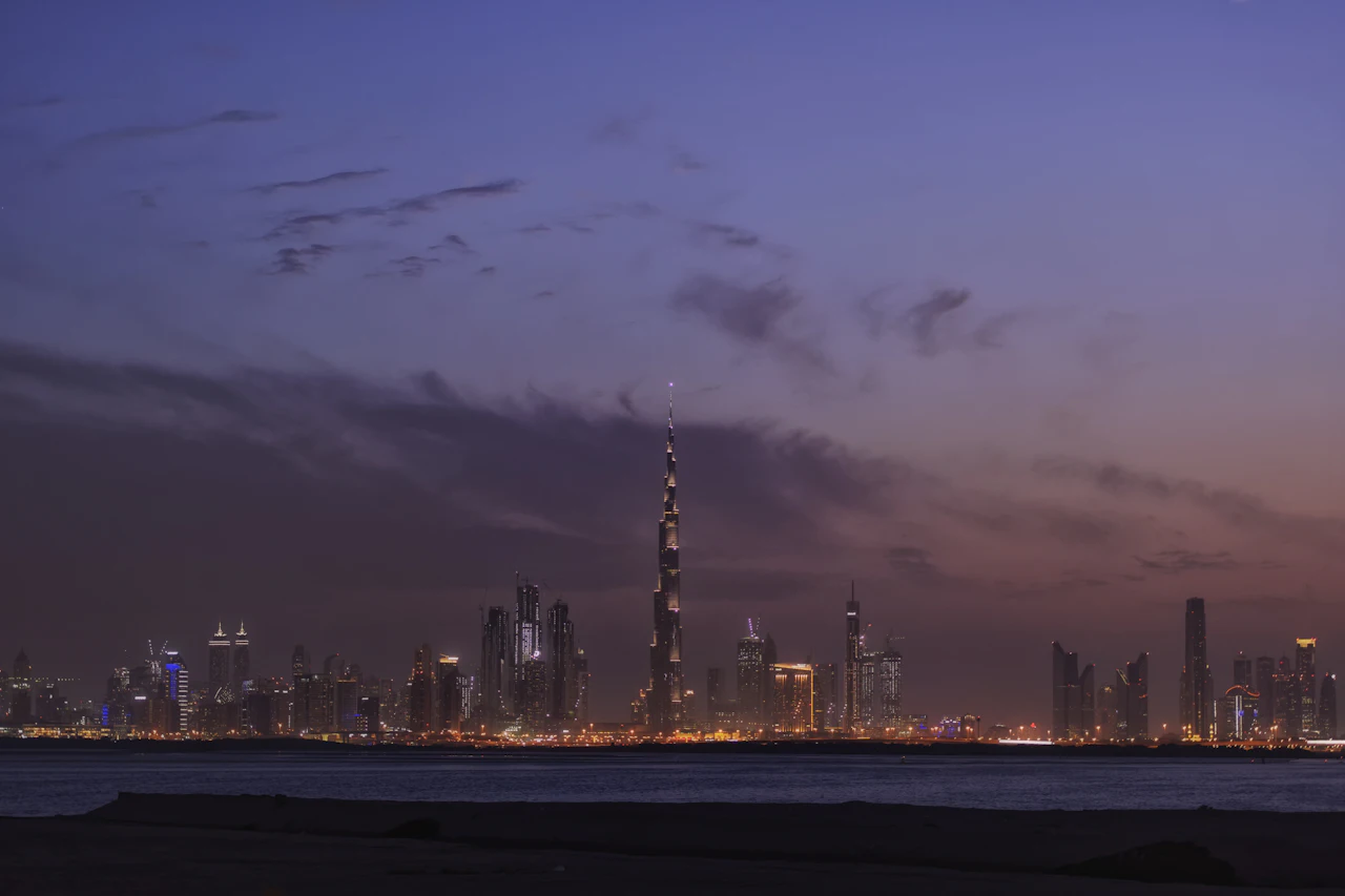 Dubai skyline across the water at night