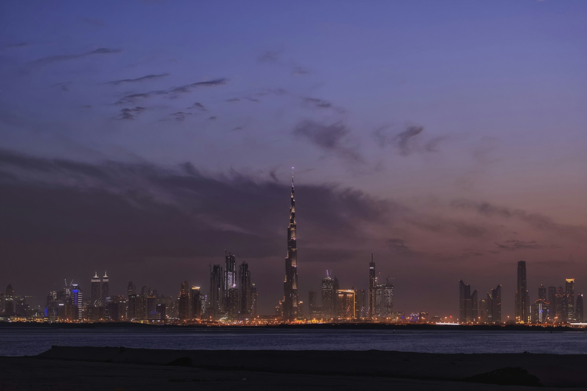 a view of a city at night from across the water