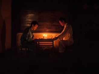 Two people sitting together in a calm room, engaged in heartfelt conversation.